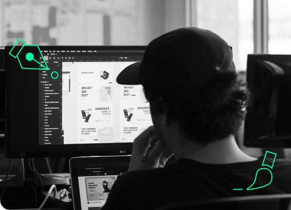 An engaging snapshot of UX/UI design in action: a team member intently reviewing a computer screen displaying a design file